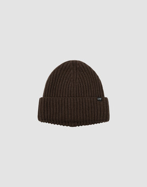 A brown LIVE FAST DIE YOUNG Rib Knit Beanie with a folded brim and small black side flaglabel, shown on a plain light gray background.
