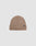 The Live Fast Boucle Beanie by LIVE FAST DIE YOUNG is a light brown ribbed polyester beanie with a folded brim and a small black flag-label on the front, shown against a plain light gray background.