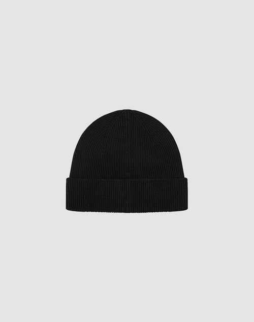 The LIVE FAST DIE YOUNG Live Fast Boucle Beanie is a black, ribbed knit polyester beanie with a folded brim, shown on a plain light gray background. This one-size style features subtle Metall-Branding for a modern touch.