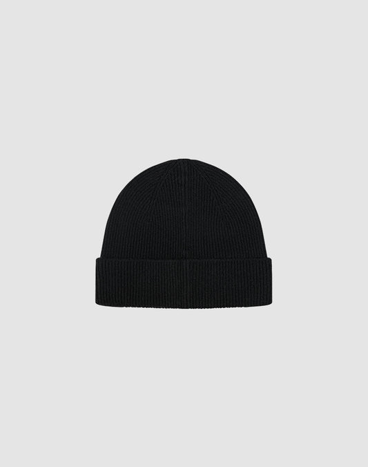 The LIVE FAST DIE YOUNG Live Fast Boucle Beanie is a black, ribbed knit polyester beanie with a folded brim, shown on a plain light gray background. This one-size style features subtle Metall-Branding for a modern touch.