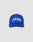 The Live Fast Unstructured Cap by LIVE FAST DIE YOUNG is a blue baseball cap with LIVE FAST in bold white letters on the front and a Flag-Label on the side, displayed against a plain light gray background.