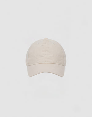 The LIVE FAST DIE YOUNG Basic Cap is a plain beige baseball cap crafted from soft cotton, shown front-facing against a light gray background.