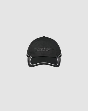 The LIVE FAST DIE YOUNG Live Fast 3000 Cap is a black polyester baseball cap with white trim, an embroidered Logo-Stick on the front, and a Klettverschluss at the back, shown against a light gray background.
