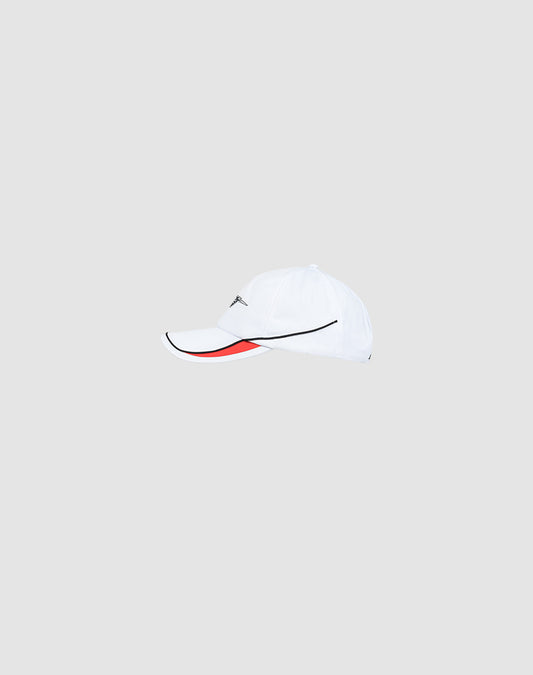 The LIVE FAST DIE YOUNG Live Fast 3000 Cap is a white baseball cap with piped trim on the curved brim, a black line detail, subtle logo stitching, and a red accent under the visor, shown on a plain light gray background.