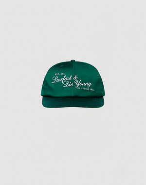 The LFDY Satin Snapback by LIVE FAST DIE YOUNG is a green cap with white 3D-Stick embroidery on the front and a snap closure, shown against a plain light gray background.| plain 