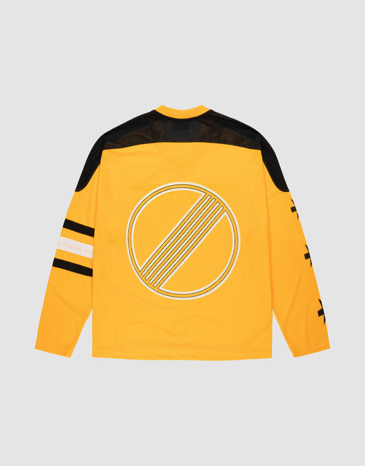 The LFDY Autobahn Jersey by LIVE FAST DIE YOUNG is a yellow, oversized long-sleeve 100% polyester top with black shoulders, black and white stripes on one sleeve, a large white geometric circle on the back, and bold multilogo graphics on the other sleeve.