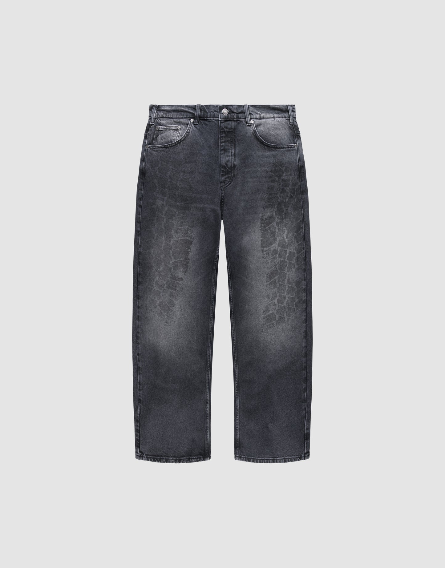 The LFDY Tire Tracks Denim by LIVE FAST DIE YOUNG are wide-leg black jeans with a baggy fit, faded distressed tire track pattern on the front, five pockets, button closure, 100% cotton, shown on a plain light gray background.