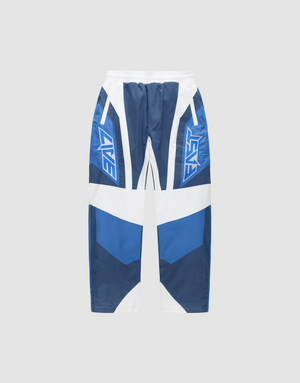 The LFDY Cross Pants by LIVE FAST DIE YOUNG feature a blue and white color-blocked design, bold LIVE and FAST graphics on each leg, oversize fit with weites Bein, displayed against a plain light gray background. | plain