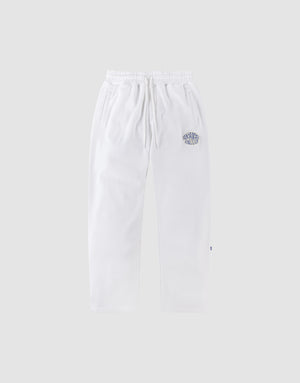 LFDY Radiator Sweatpants by LIVE FAST DIE YOUNG in white, with an elastic waistband and side pockets. Shown on a light gray background, featuring a blue and white chenille patch on the upper left thigh. | plain