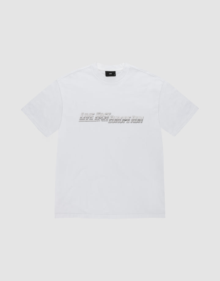 The LFDY Europe Run Tee by LIVE FAST DIE YOUNG is a plain white, short-sleeve t-shirt made of 100% Baumwolle, featuring "LIVE FAST BREAK IT SLOW" in gray blocky letters across the chest on a light gray background. | plain