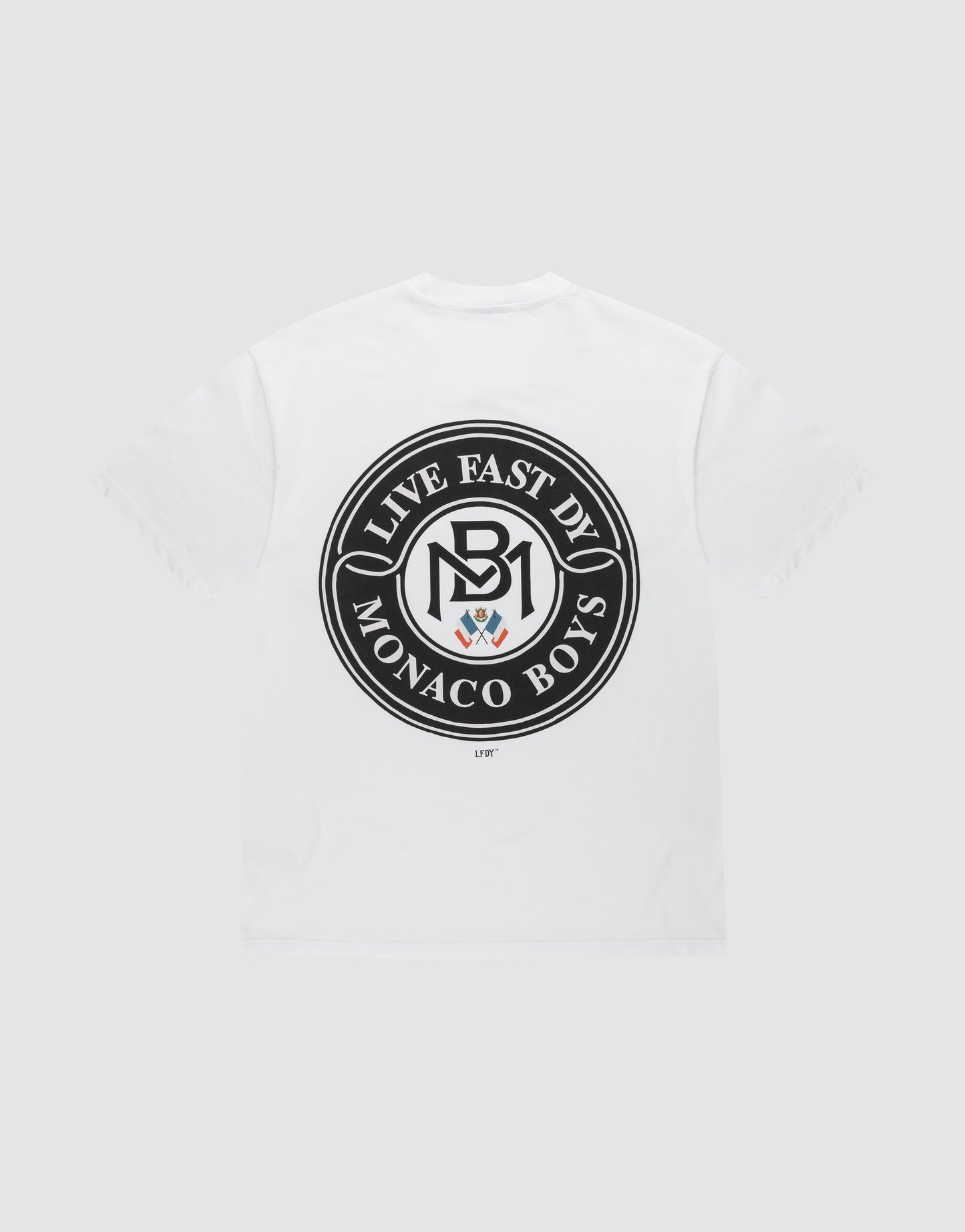 The LFDY Monaco Boys Tee by LIVE FAST DIE YOUNG is a white Oversize Fit T-shirt with a black circular back emblem reading "LIVE FAST DIE MONACO BOYS" around an MB logo and crest. Made from 100% cotton for comfort. | plain