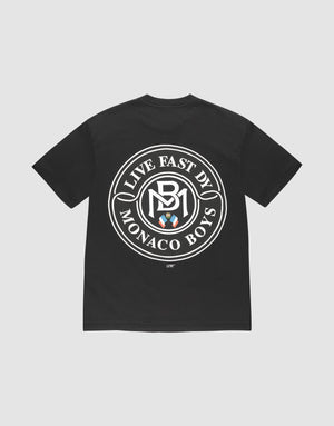 The LFDY Monaco Boys Tee by LIVE FAST DIE YOUNG features an oversize black fit, a bold white circular logo with "LIVE EAST DY MONACO BOYS" and three shields on the back, "LIFT" near the hem, and is made of 100% cotton. | plain