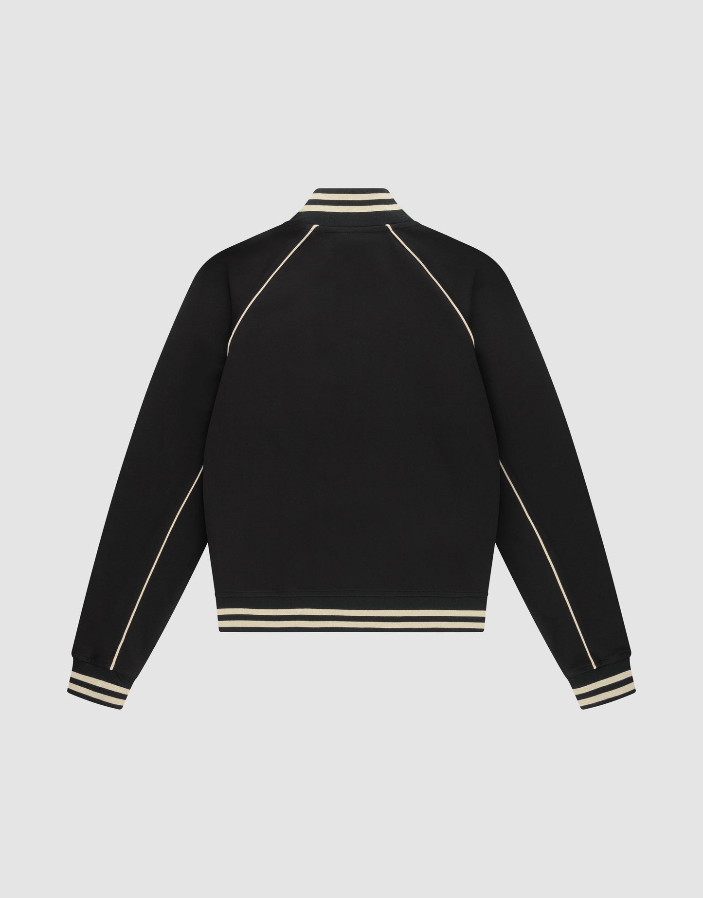 The Live Fast Tracksuit Jacket by LIVE FAST DIE YOUNG is a black varsity-style piece with cream stripes on the ribbed collar, cuffs, and hem, plus cream piping on the sleeves and shoulders. Made from Baumwolle Polyester in a regular fit.