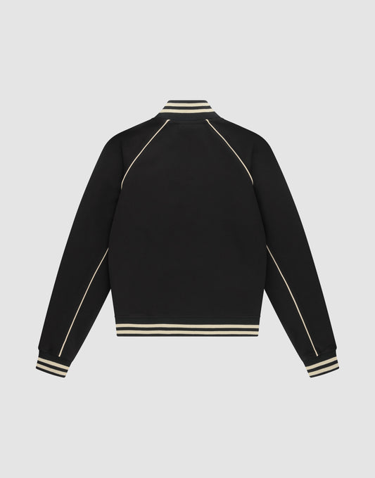The Live Fast Tracksuit Jacket by LIVE FAST DIE YOUNG is a black varsity-style piece with cream stripes on the ribbed collar, cuffs, and hem, plus cream piping on the sleeves and shoulders. Made from Baumwolle Polyester in a regular fit.