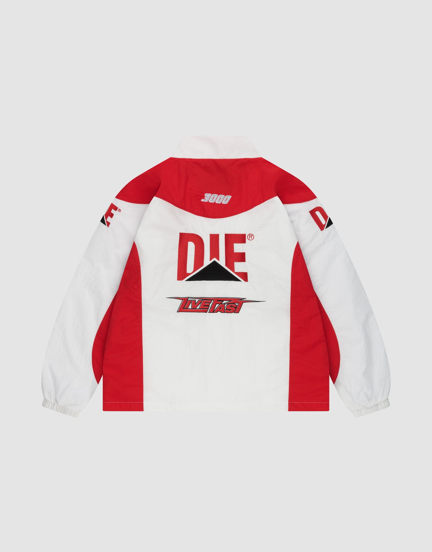 The LFDY Trackjacket 3000 by LIVE FAST DIE YOUNG features red and white blocks, bold DIE text, a black triangle, Multilogo Stick details, LIVE FAST on the back, 3000 near the collar, DIE logos on both sleeves, and a Reißverschluss-Puller. Regular fit.