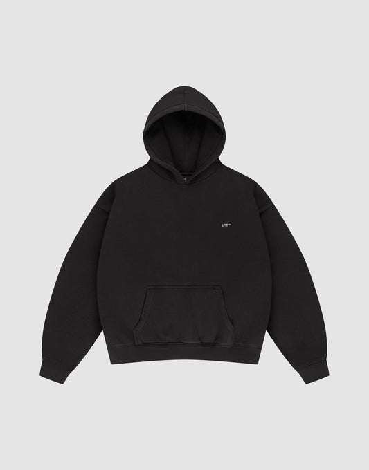 The LFDY Monaco Boys Hooded by LIVE FAST DIE YOUNG is a plain black, oversized hoodie with a front pocket and hood, featuring small white "LIFE" text on the left chest, shown on a light gray background.