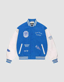 The LFDY x Schott NYC Varsity Jacket by LIVE FAST DIE YOUNG is a limited edition blue jacket with white leather sleeves, striped trims, and white embroidered patches and text on the chest, sleeves, and front. | plain