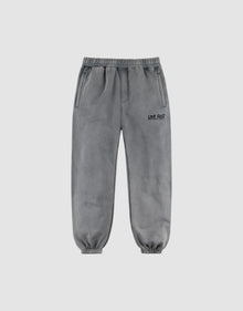 The LFDY Europe Run Jogger by LIVE FAST DIE YOUNG features gray, loose-fit sweatpants with an elastic waistband and cuffs, side pockets, and "LIVE FAST" printed in black on the left thigh, displayed on a plain light background. | plain