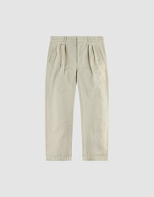 The Wide Chino by LIVE FAST DIE YOUNG features a beige hue, belt loops, side pockets, wide fit with konisches Bein, and is crafted from 100% Baumwolle, shown laid flat on a plain white background. | plain