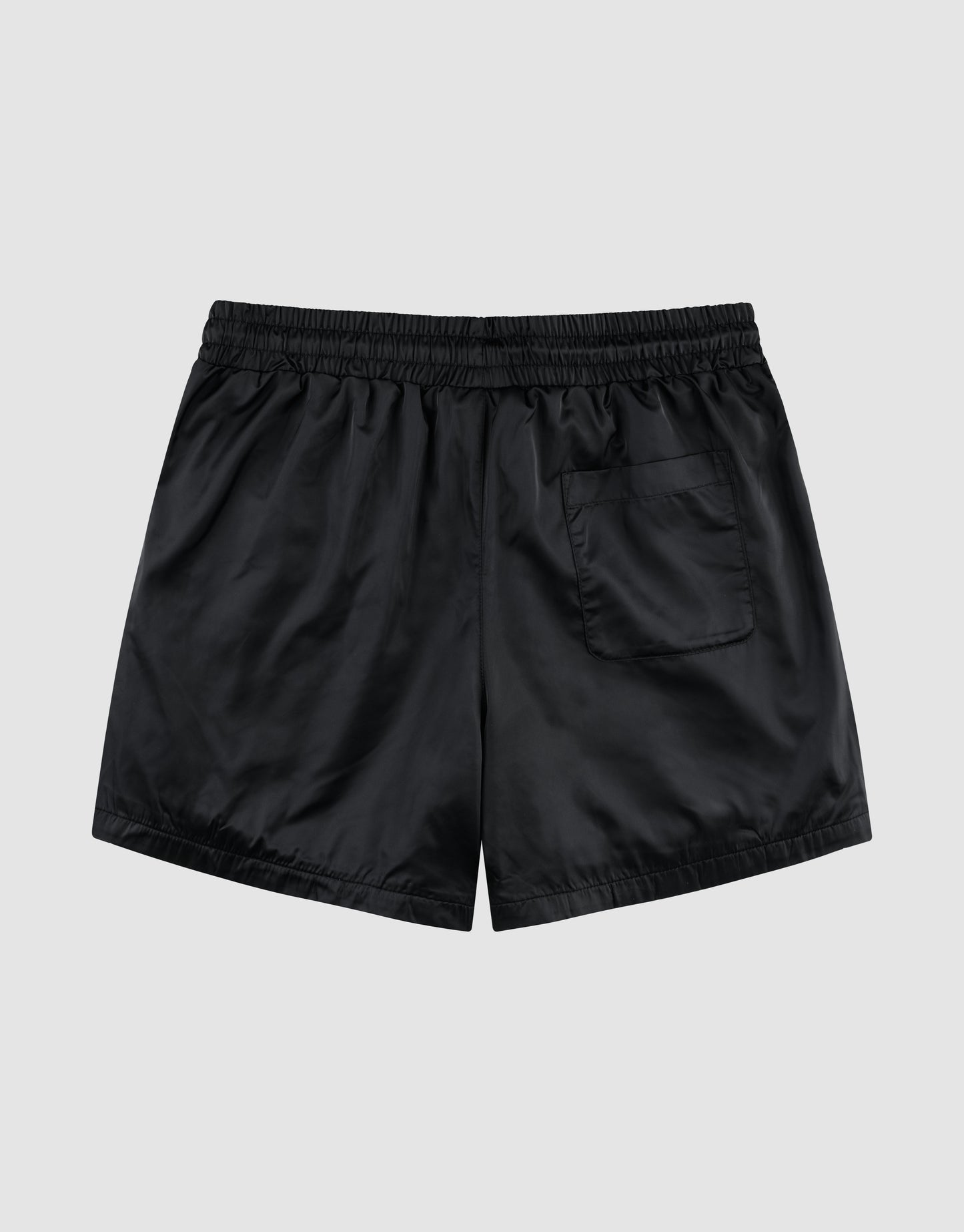 LFDY Retro Satin Shorts by LIVE FAST DIE YOUNG in black with elastic waistband, oversized fit, and single back pocket, shown flat on a light gray background.