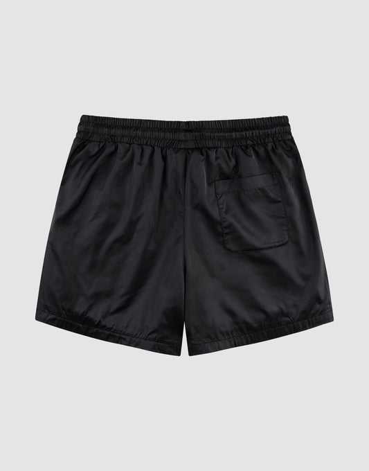 LFDY Retro Satin Shorts by LIVE FAST DIE YOUNG in black with elastic waistband, oversized fit, and single back pocket, shown flat on a light gray background.