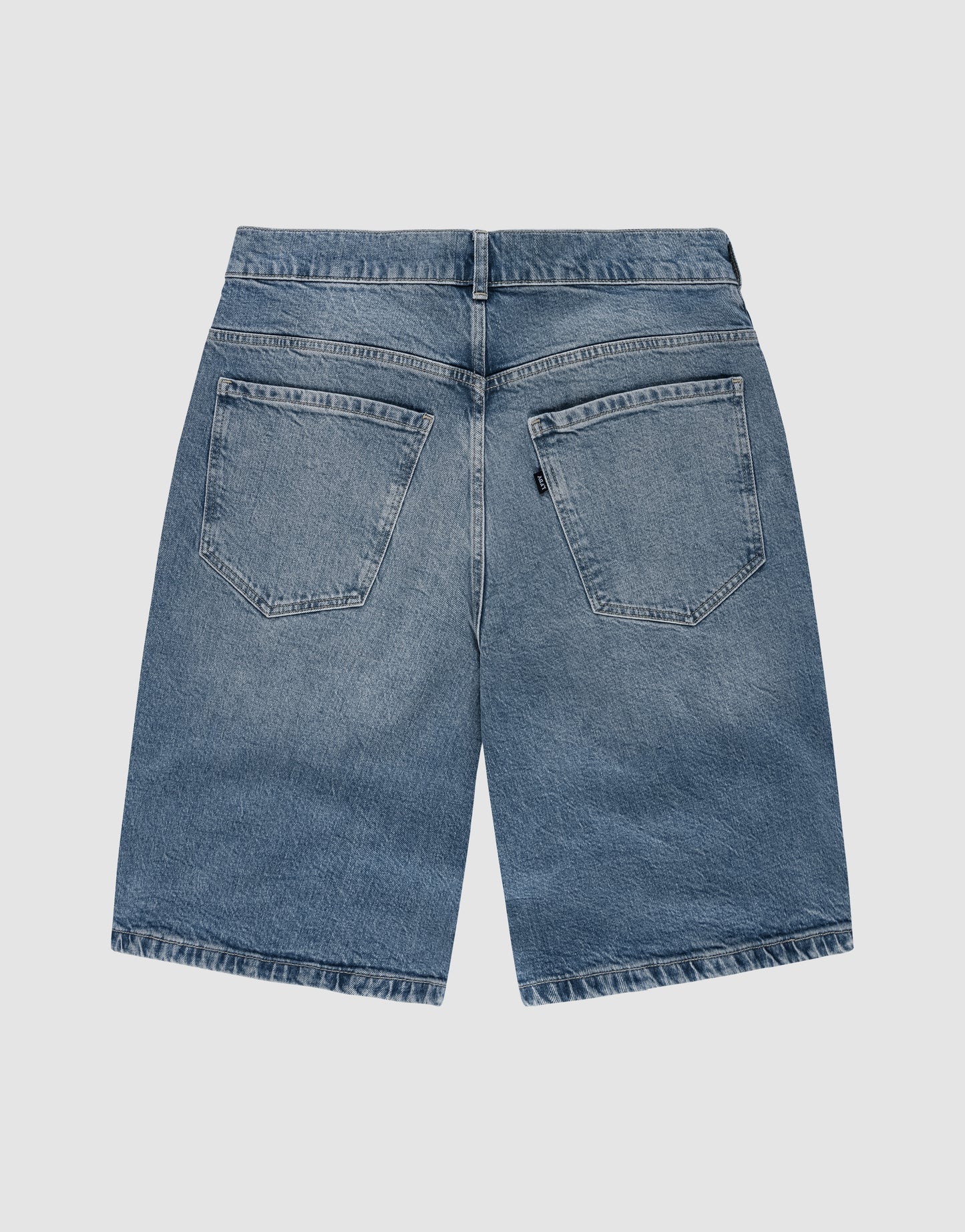 Back view of LIVE FAST DIE YOUNG LFDY Tire Tracks Jorts in a baggy blue denim fit, with two large back pockets and belt loop waistband, featuring gerades Bein, laid flat on a plain white background.