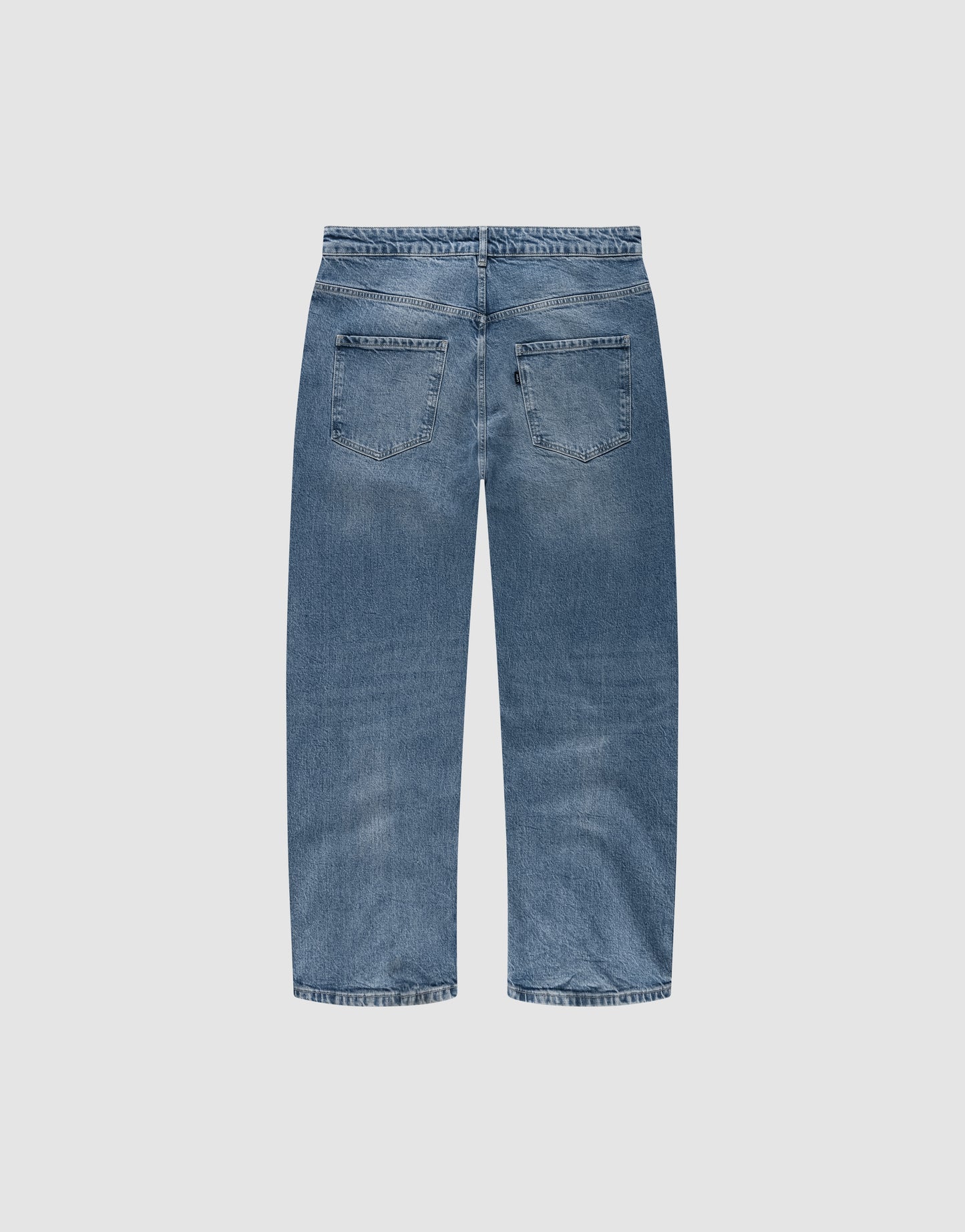 Back view of the LFDY Tire Tracks Denim by LIVE FAST DIE YOUNG in blue, featuring a baggy fit, straight leg, two back pockets, subtle fading on seat and thighs. Crafted from 100% cotton and displayed on a plain white background.