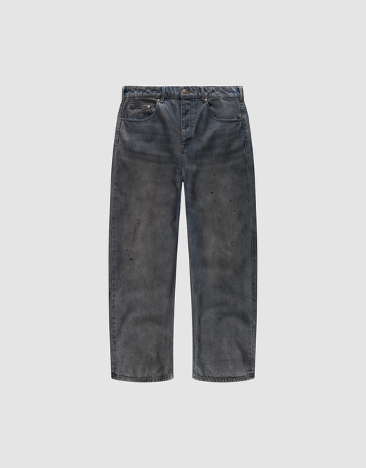 The LFDY Coated Baggy Denim by LIVE FAST DIE YOUNG features wide legs, a baggy fit, faded black 100% Baumwolle fabric, distressed detailing, and subtle paint splatters, shown against a plain white background. | plain