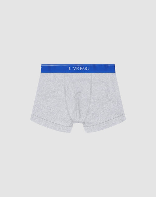 LIVE FAST DIE YOUNG Live Fast Trunks (2 Pack): Light grey mens Regular Fit boxer briefs in soft cotton, blue elastic waistband with LIVE FAST in white, shown on a plain white background.