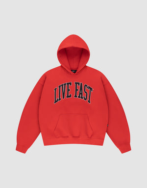The LIVE FAST DIE YOUNG Live Fast College Hooded is a red oversize hoodie with a front pocket and bold black and white "LIVE FAST" print across the chest, shown on a plain light gray background. | plain