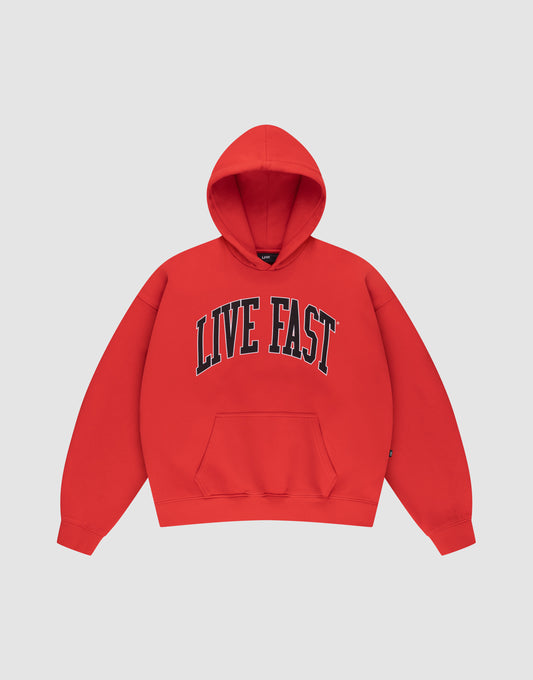 The LIVE FAST DIE YOUNG Live Fast College Hooded is a red oversize hoodie with a front pocket and bold black and white "LIVE FAST" print across the chest, shown on a plain light gray background. | plain