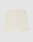 Die Basic Knit Shorts von LIVE FAST DIE YOUNG in Beige aus gerippter Baumwolle haben einen elastischen Bund mit Kordelzug, zwei aufgesetzte Taschen und sind knielang. Das Modell ist flach auf weißem Hintergrund ausgebreitet.