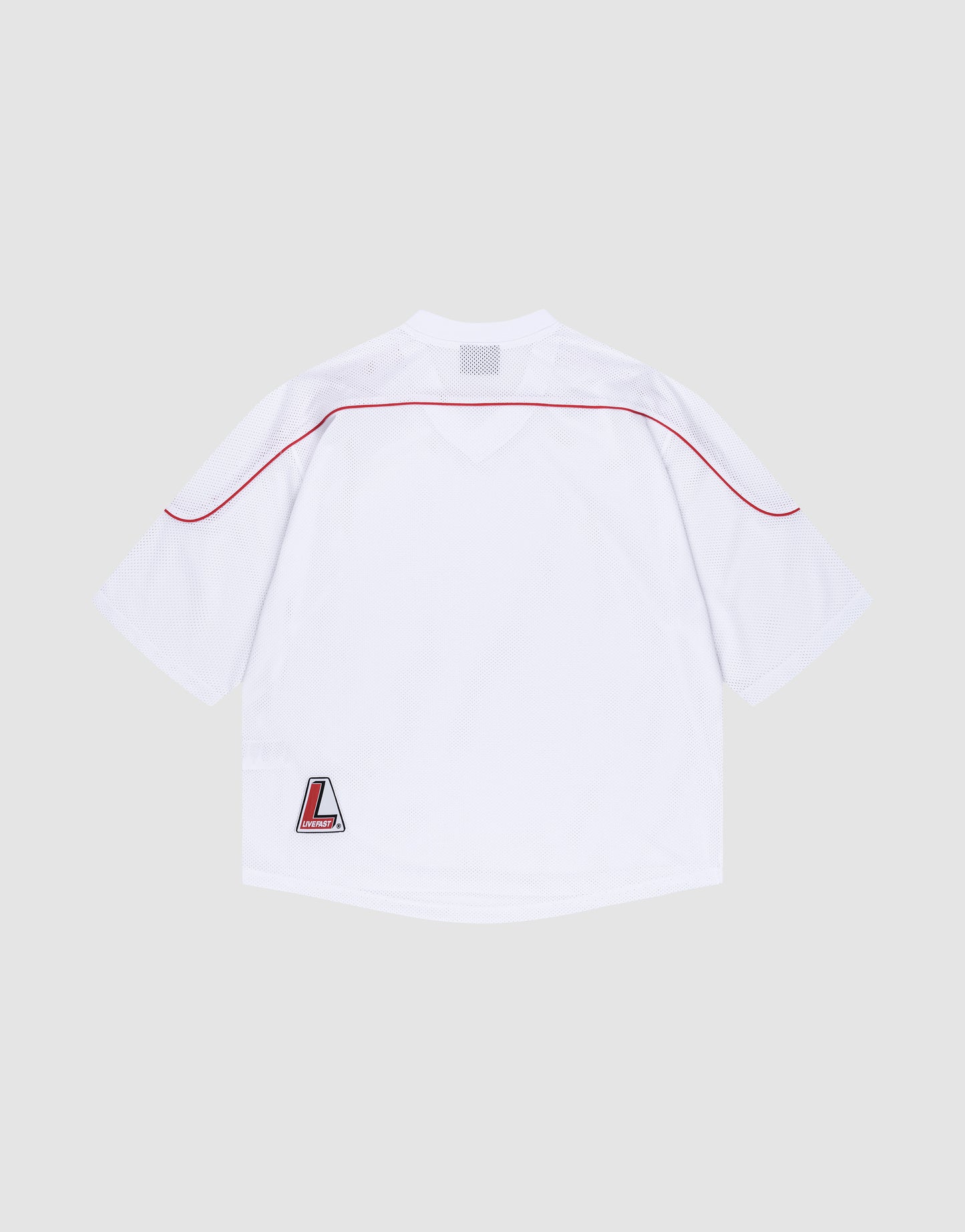The Basic Mesh Jersey by LIVE FAST DIE YOUNG is a plain white polyester sports top with short sleeves, a red shoulder stripe, V-Ausschnitt neckline, and L logo patch at the lower left hem. It’s shown laid flat, back view, on a light gray background.