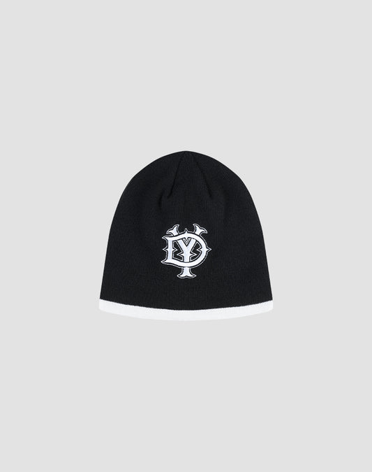 The DY Stripe Beanie by LIVE FAST DIE YOUNG is a black polyester knit with a white bottom trim and an embroidered DY Stick logo on the front, featuring overlapping Y and S letters. Shown on a light gray background. Style code: LF2411-16612.