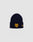 The DY Beanie by LIVE FAST DIE YOUNG is a navy blue polyacryl beanie with a folded brim, featuring a yellow Logo-Stick Y crest on the front and a small yellow text patch on the side, set against a plain light gray background.