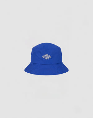A bright blue Nylon Bucket Hat by LIVE FAST DIE YOUNG features a small oval Live Fast Logo-Stick patch on the front, shown against a plain white background.