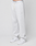 A person wears the LIVE FAST DIE YOUNG Basic Loose Jogger in light gray, featuring a logo print waistband with white drawstring, side pockets, and small embroidered detail on the left thigh, paired with white sneakers against a plain background.
