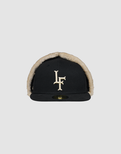 The LFDY x New Era 59Fifty DogEar by LIVE FAST DIE YOUNG features beige faux fur lining and a bold LF Kunstpelz logo on the front. Shown is the fitted cap on a plain gray background.