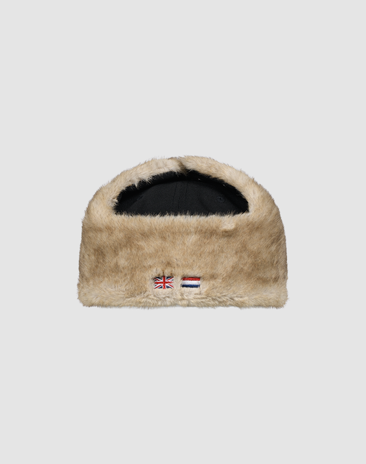 The LFDY x New Era 59Fifty DogEar by LIVE FAST DIE YOUNG is a tan Kunstpelz Logo hat with a black interior and embroidered British and Dutch flags on the front, shown against a light gray background. Inspired by Schwarze Dogear and New Era Flag styles.