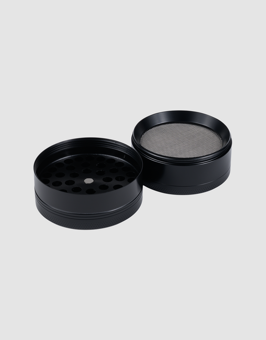 The Live Fast Grinder by LIVE FAST DIE YOUNG is a 55 mm aluminum grinder with two separate parts—one with holes and the other featuring a fine mesh screen—set against a plain light gray background.