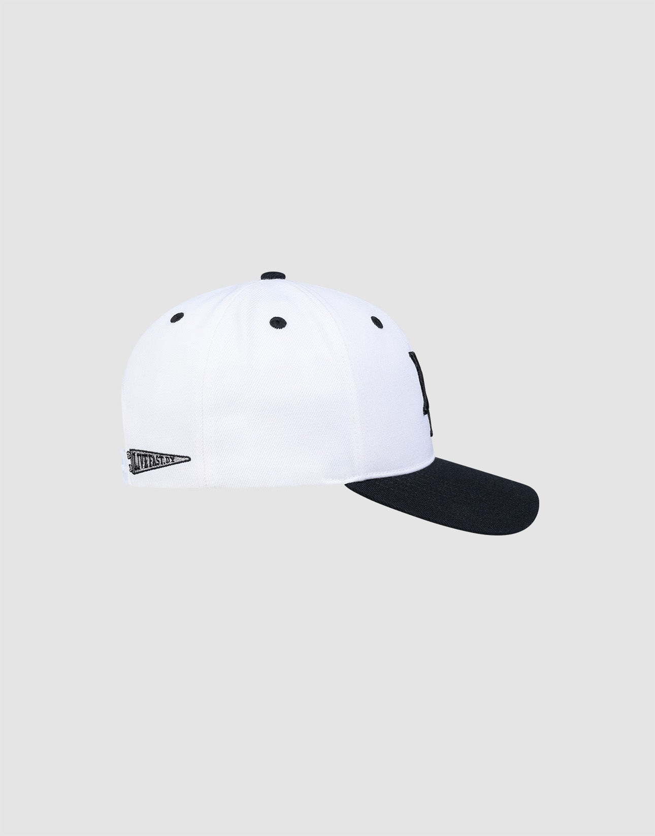 The LFDY Snapback by LIVE FAST DIE YOUNG features a white crown, black brim, green underbill, black top button and eyelets, snap closure, and a small "World Series" patch on the side. Shown on a light gray background.