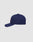 The LFDY Snapback by LIVE FAST DIE YOUNG is a navy blue cap with a curved brim, visible stitching, and adjustable Snapverschluss. It’s displayed side-on against a plain light gray background.