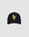 The LFDY Snapback by LIVE FAST DIE YOUNG is a black cap with a curved brim, green underside, large yellow LF initials on the front, a colorful patch on the left, and an adjustable snap closure. Shown on a plain light gray background.