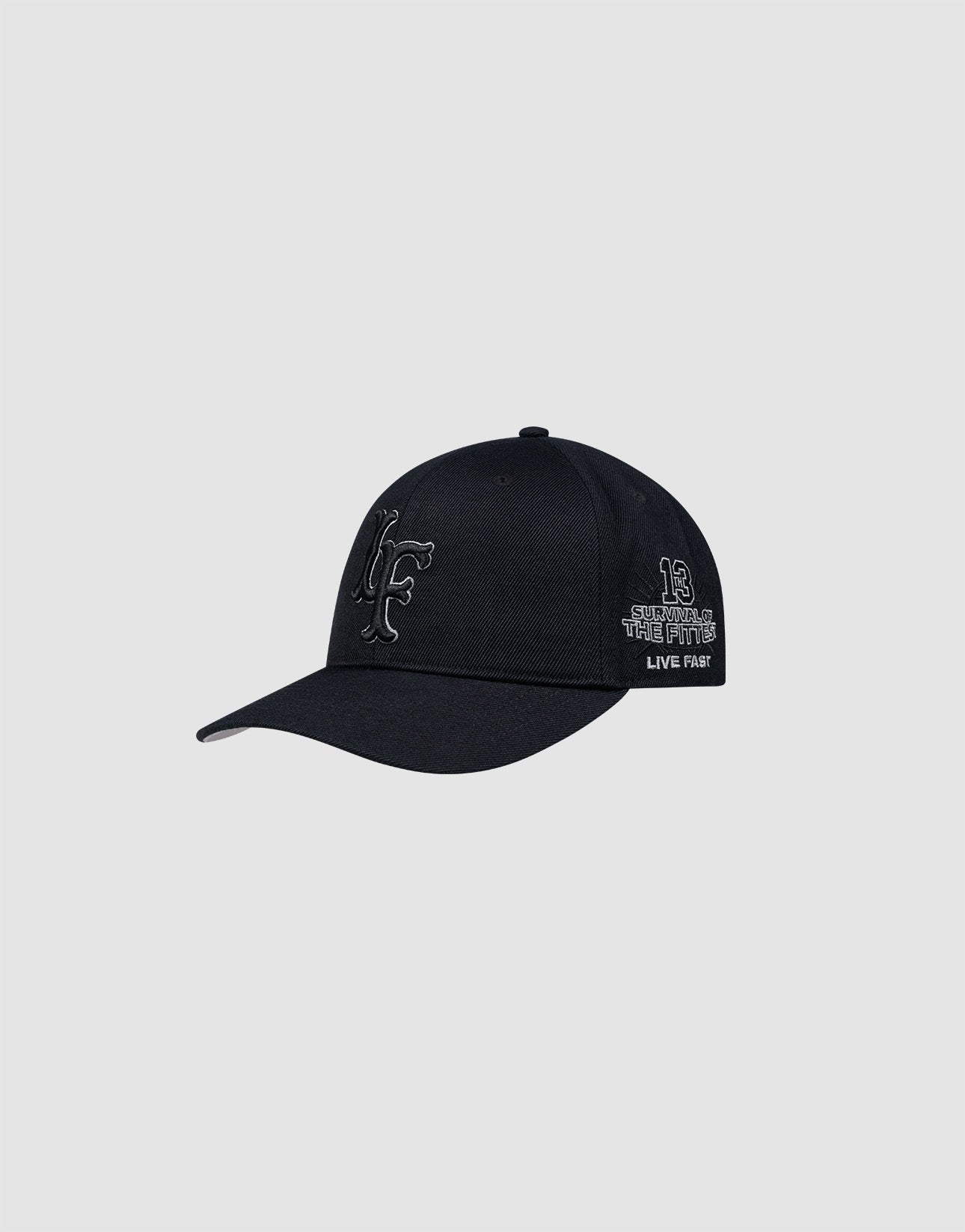 The LFDY Snapback by LIVE FAST DIE YOUNG is a black cap with Multi-Logo-Stick, featuring a large stylized F on the front and "13, September the Fifth, Live Fast" on the side. It has Snapverschluss and a gray underside, shown on a plain gray background.