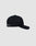 The LFDY Snapback by LIVE FAST DIE YOUNG in black is shown side-on against a plain light gray background, featuring a curved brim with grey underside, Multi-Logo-Stick embroidery near the back, and an adjustable snap closure.
