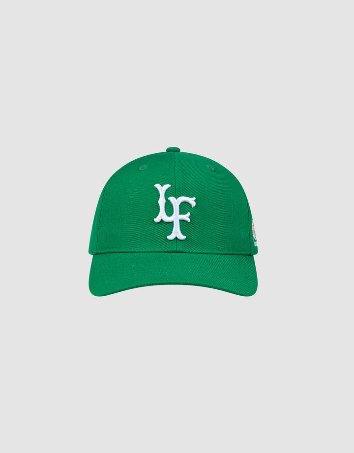 The LFDY Snapback by LIVE FAST DIE YOUNG features a green design with white LF embroidery on the front, matching green underbill, and an adjustable snap closure, shown against a plain light gray background.