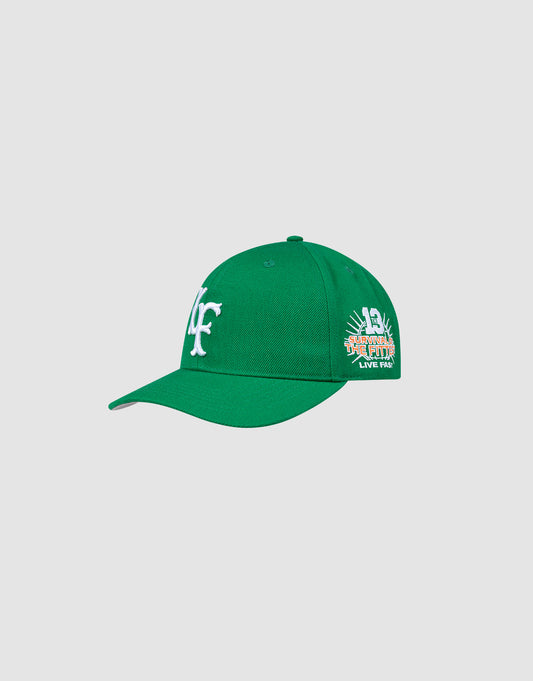 The LFDY Snapback by LIVE FAST DIE YOUNG features a green cap with white embroidered LF front logo, colorful Multi-Logo-Stick design, "LIVE FAIR" side text, curved brim, green underbill, snap closure, and top button.
