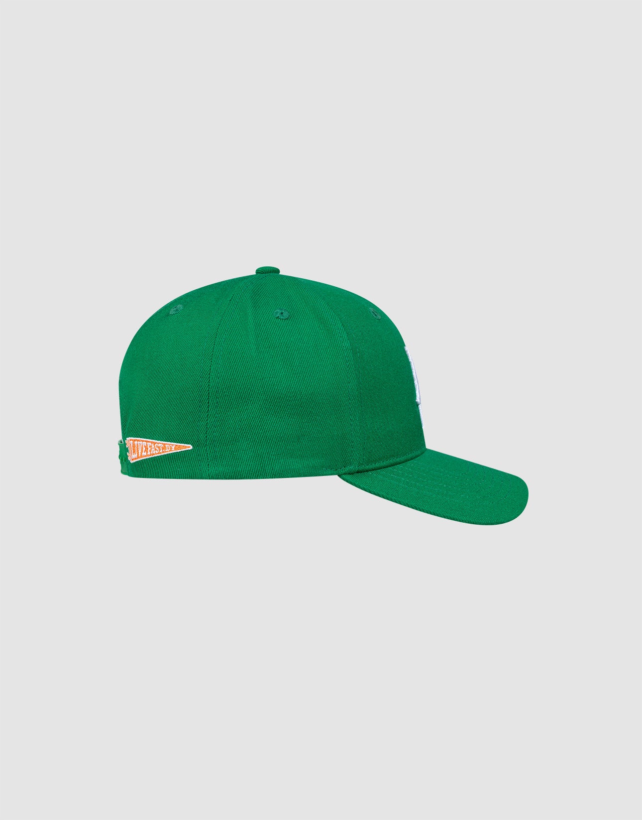 The LFDY Snapback by LIVE FAST DIE YOUNG is shown from the side in green, featuring a small orange and white pennant patch near the back and a practical snap closure. The background is plain light gray.