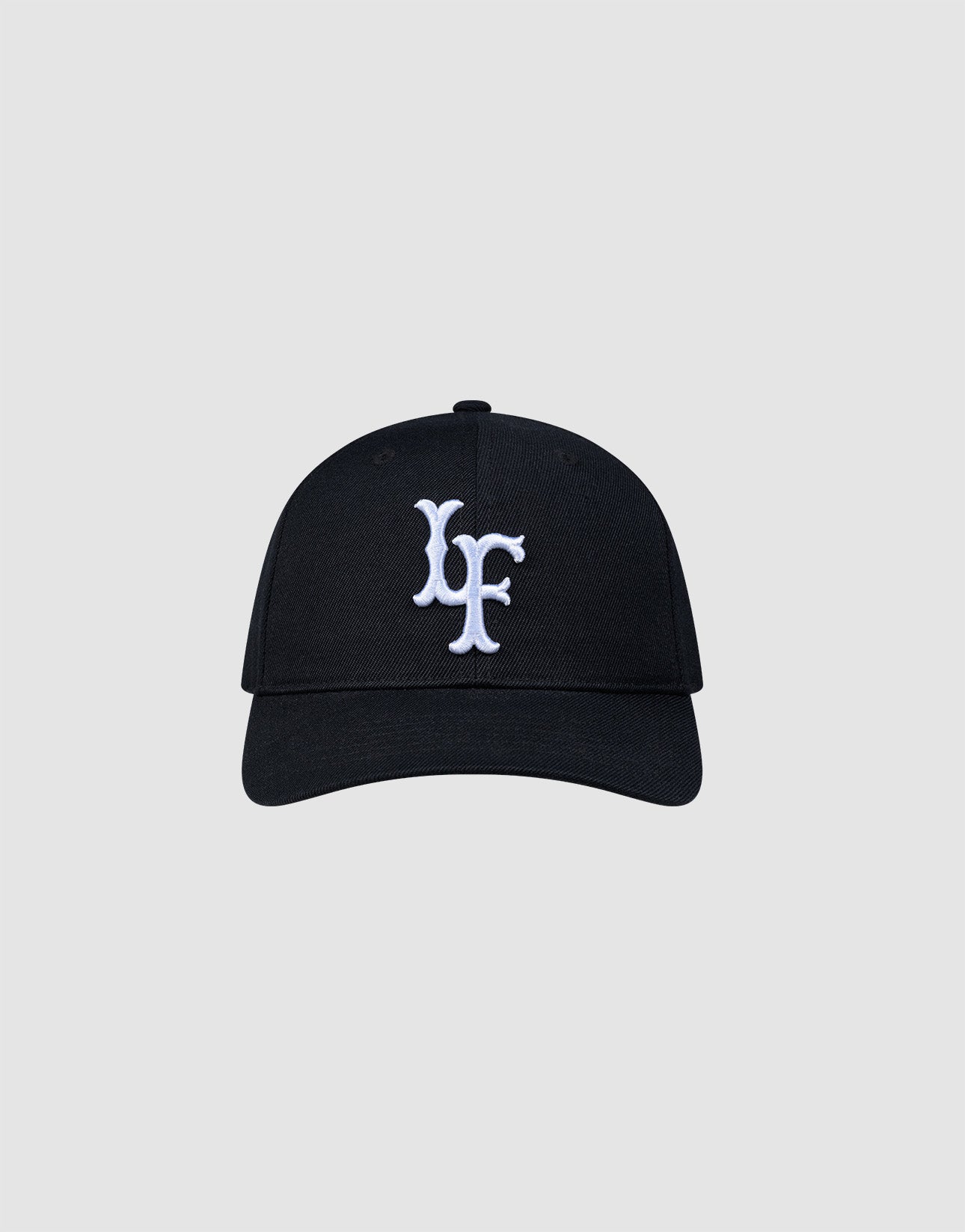 The LFDY Snapback by LIVE FAST DIE YOUNG features a black design, curved brim, white embroidered multi-logo on the front, and an adjustable snap closure. Shown against a plain light gray background. ONE SIZE fits most. 