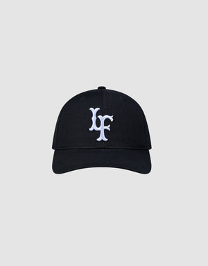 The LFDY Snapback by LIVE FAST DIE YOUNG features a black design, curved brim, white embroidered multi-logo on the front, and an adjustable snap closure. Shown against a plain light gray background. ONE SIZE fits most.